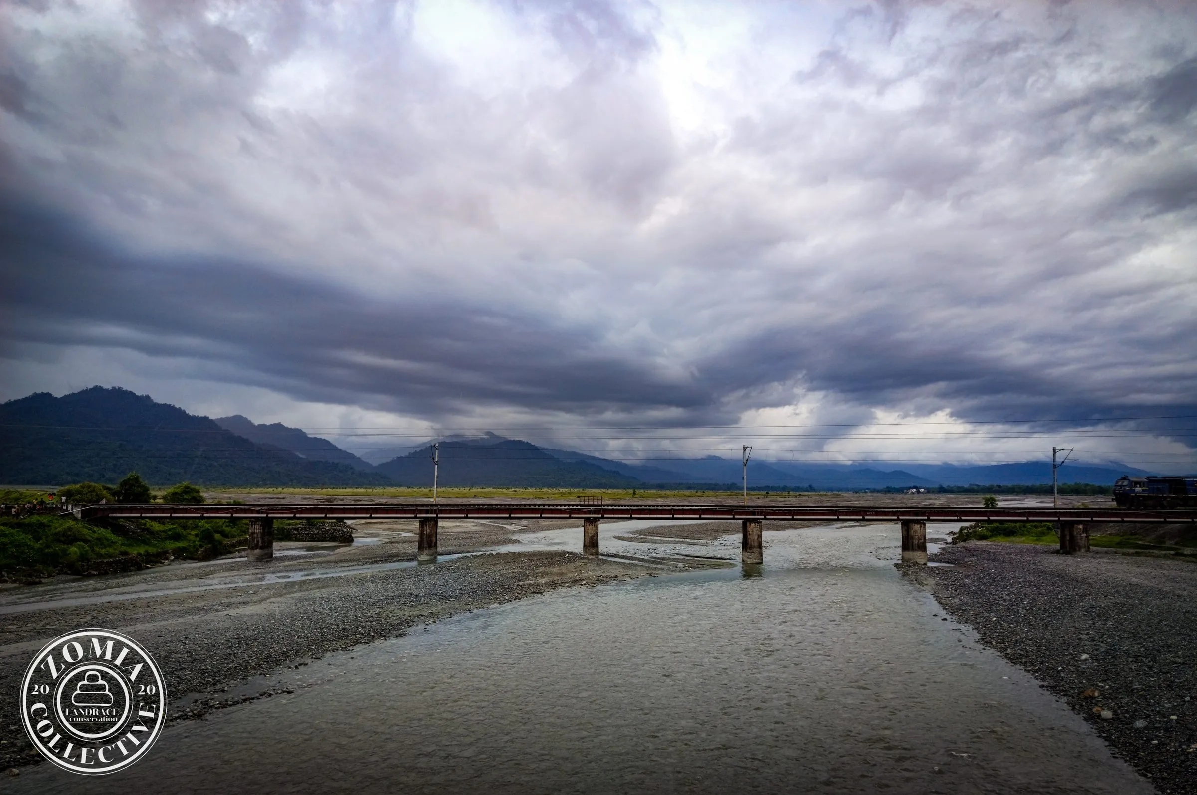 Bridge over one of the Teesta river tributaries while looking towards the Kalimpong Range