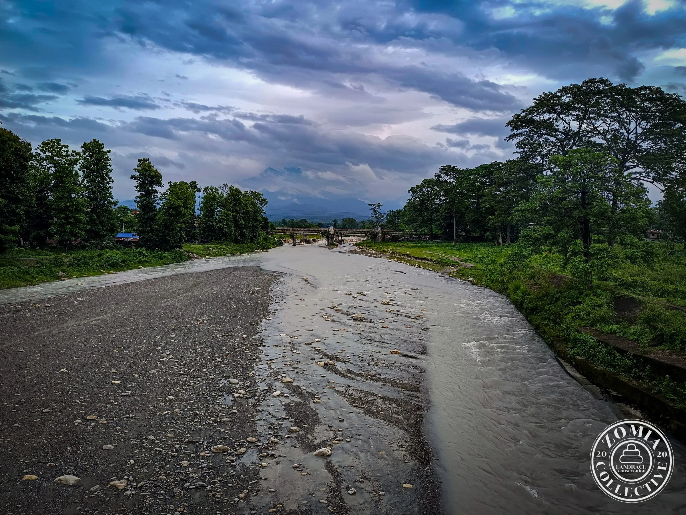 Deana River with thunderclouds over Bhutan